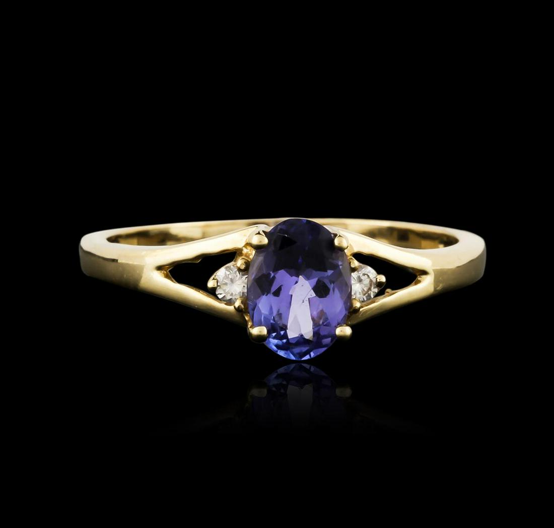 14KT Yellow Gold 0.93 ctw Tanzanite and Diamond Ring: One electronically tested 14KT yellow gold ladies cast tanzanite and diamond ring with a bright polish finish. The featured tanzanite is accented by a single diamond on either side, completed by a one