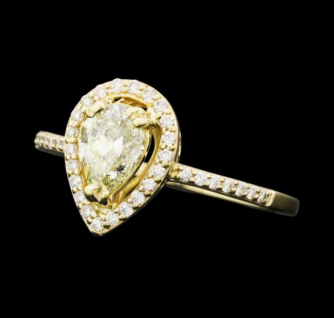 1.03 ctw Diamond Ring - 14KT Yellow Gold: One electronically tested 14KT yellow gold lady's cast wedding ring with a cathedral shank with a basket halo with a bright polish finish. The featured lady's ring has a shank measuring 1.25 millimete