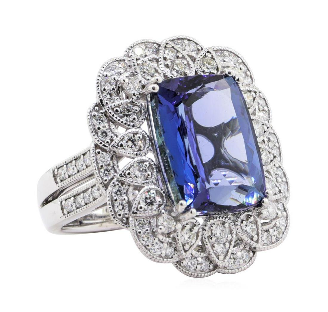 10.17 ctw Tanzanite and Diamond Ring - Platinum: One electronically tested platinum ladies cast & assembled tanzanite & diamond ring. The ring features a tanzanite set within an elegant diamond frame, supported by an elaborate lattice under gallery 