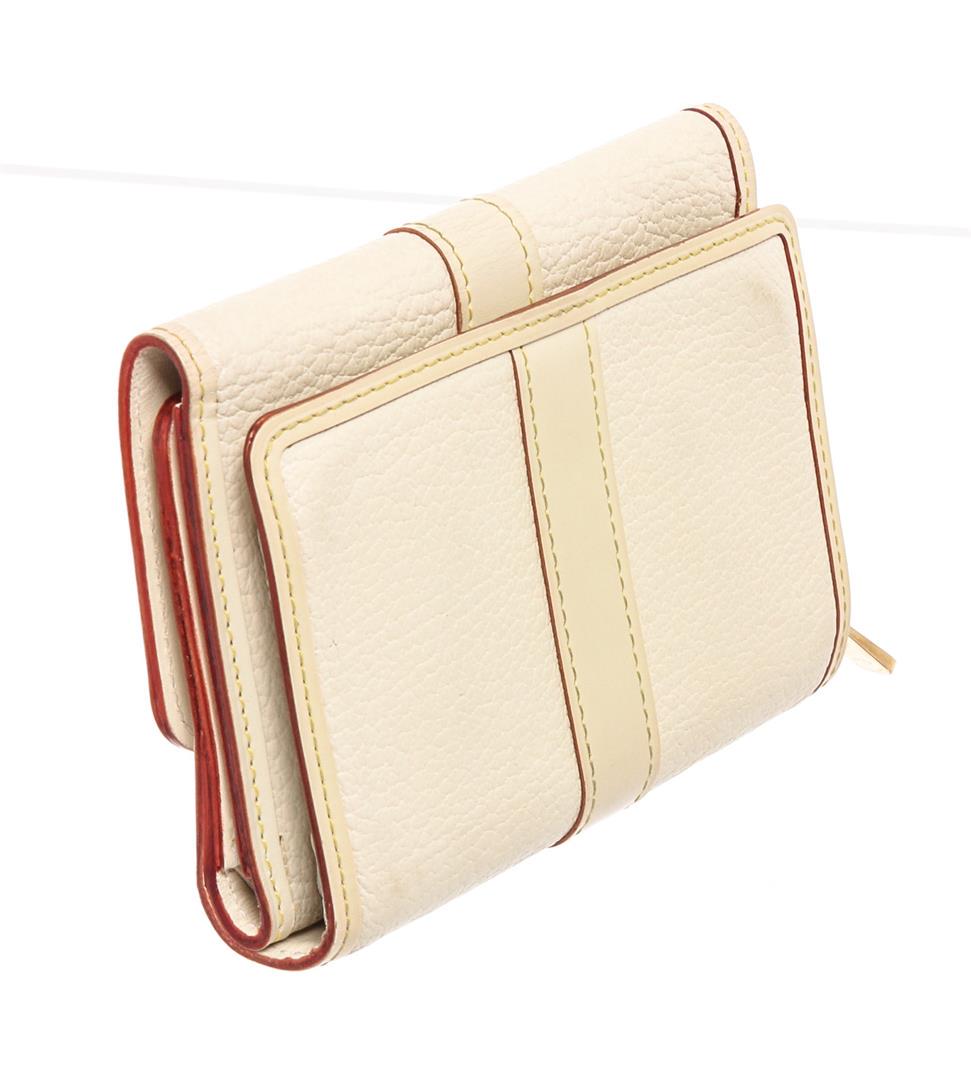 Louis Vuitton White Suhali Leather Le Favori Wallet: White Suhali leather Louis Vuitton Le Favori wallet with brass hardware, zip coin compartment at back, tonal leather lining, eight card slots, single bill compartment and snap closure at front flap.