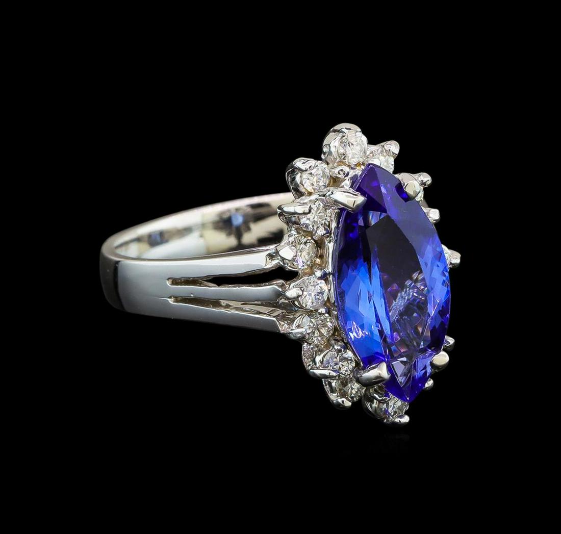 14KT White Gold 2.76 ctw Tanzanite and Diamond Ring: One electronically tested 14KT white gold ladies cast tanzanite and diamond ring with a bright polish finish. Identified with markings of "K14". Condition is new. Containing: One prong set marquise mo