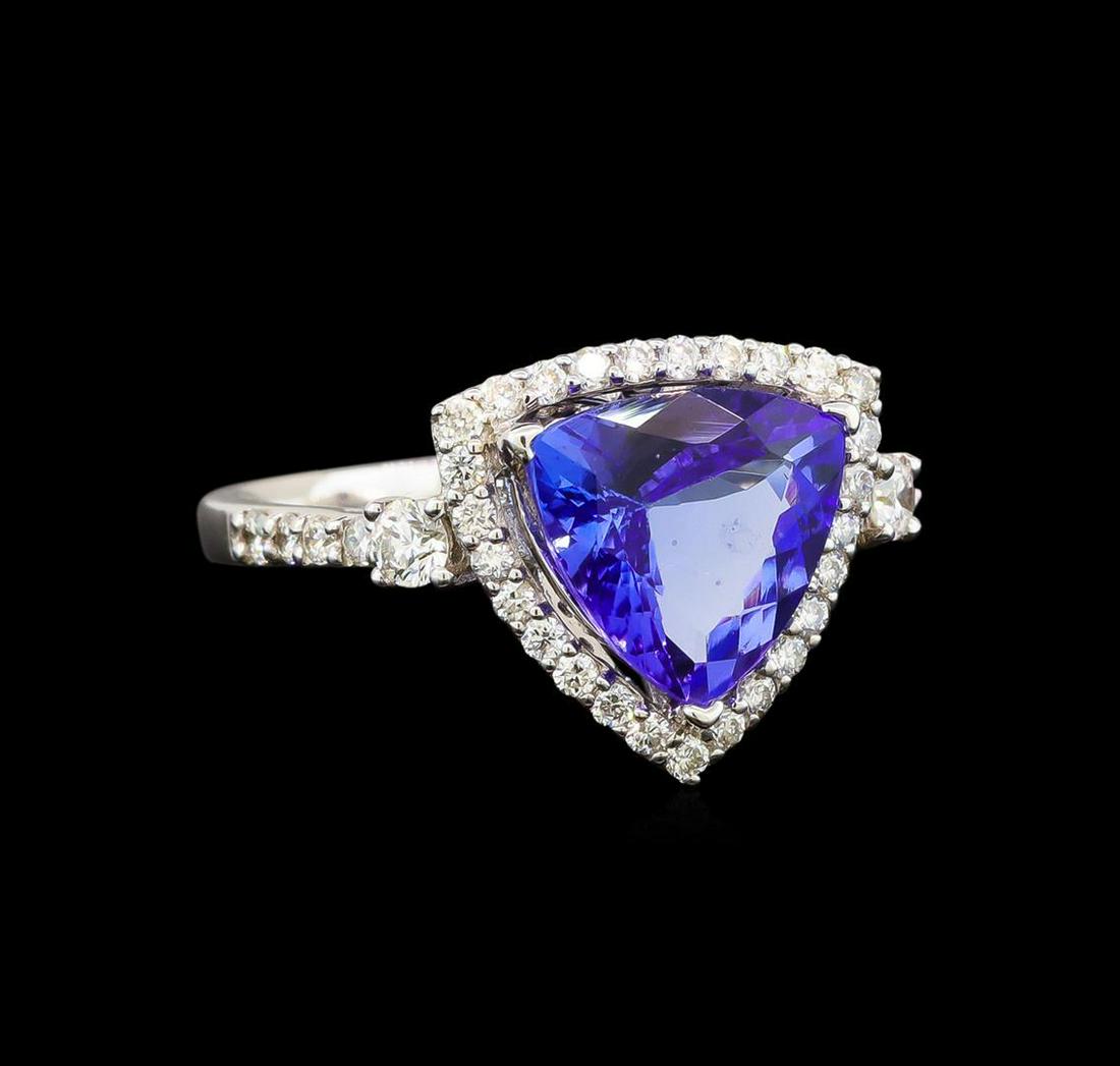 18KT White Gold 4.41 ctw Tanzanite and Diamond Ring: One electronically tested 18KT white gold ladies cast tanzanite and diamond ring with a flat shank with a bright polish finish. Trademark is Orianne. Identified with markings of "18K". Condition is ne