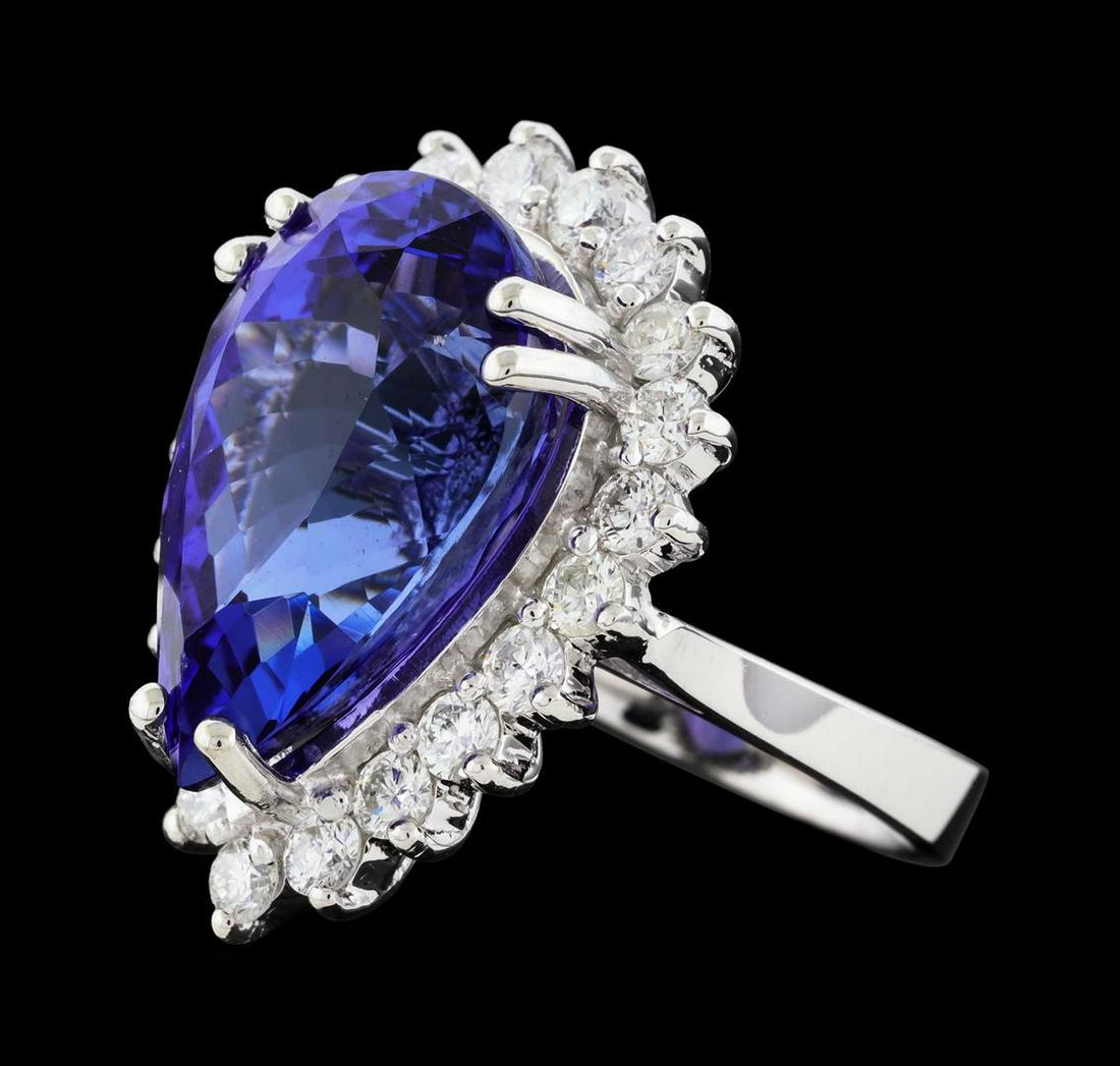 14.11 ctw Tanzanite and Diamond Ring - 14KT White Gold: One electronically tested 14KT white gold lady's cast fashion ring with a basket halo with a bright polish finish. The featured lady's ring has a shank measuring 3.27 millimeters wide. Identified with