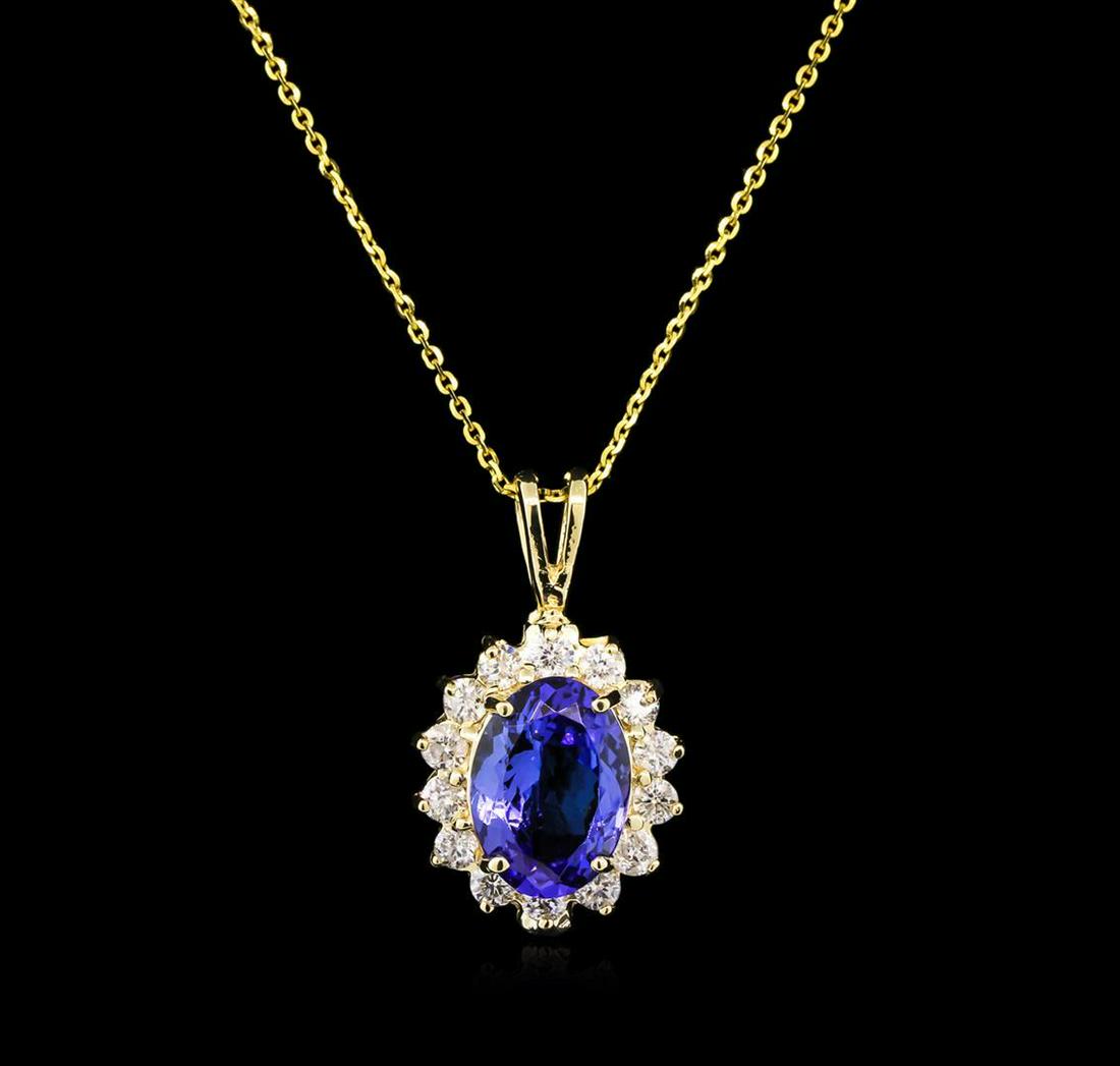 3.27 ctw Tanzanite and Diamond Pendant With Chain -: One electronically tested 14KT yellow gold lady's cast fashion pendant & chain 18.0" long, 1mm diamond cut cable link with a spring ring clasp with a halo with a bright polish finish. Identified with 