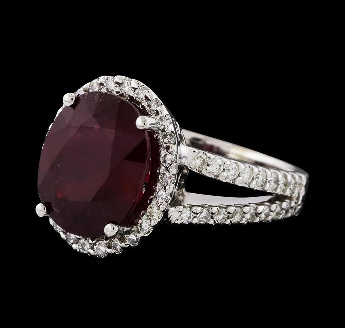 7.41 ctw Ruby and Diamond Ring - 14KT White Gold: One electronically tested 14KT white gold lady's cast fashion ring with a split shank halo with a bright polish finish. The featured lady's ring has a shank measuring 2.66 millimeters wide. Identified