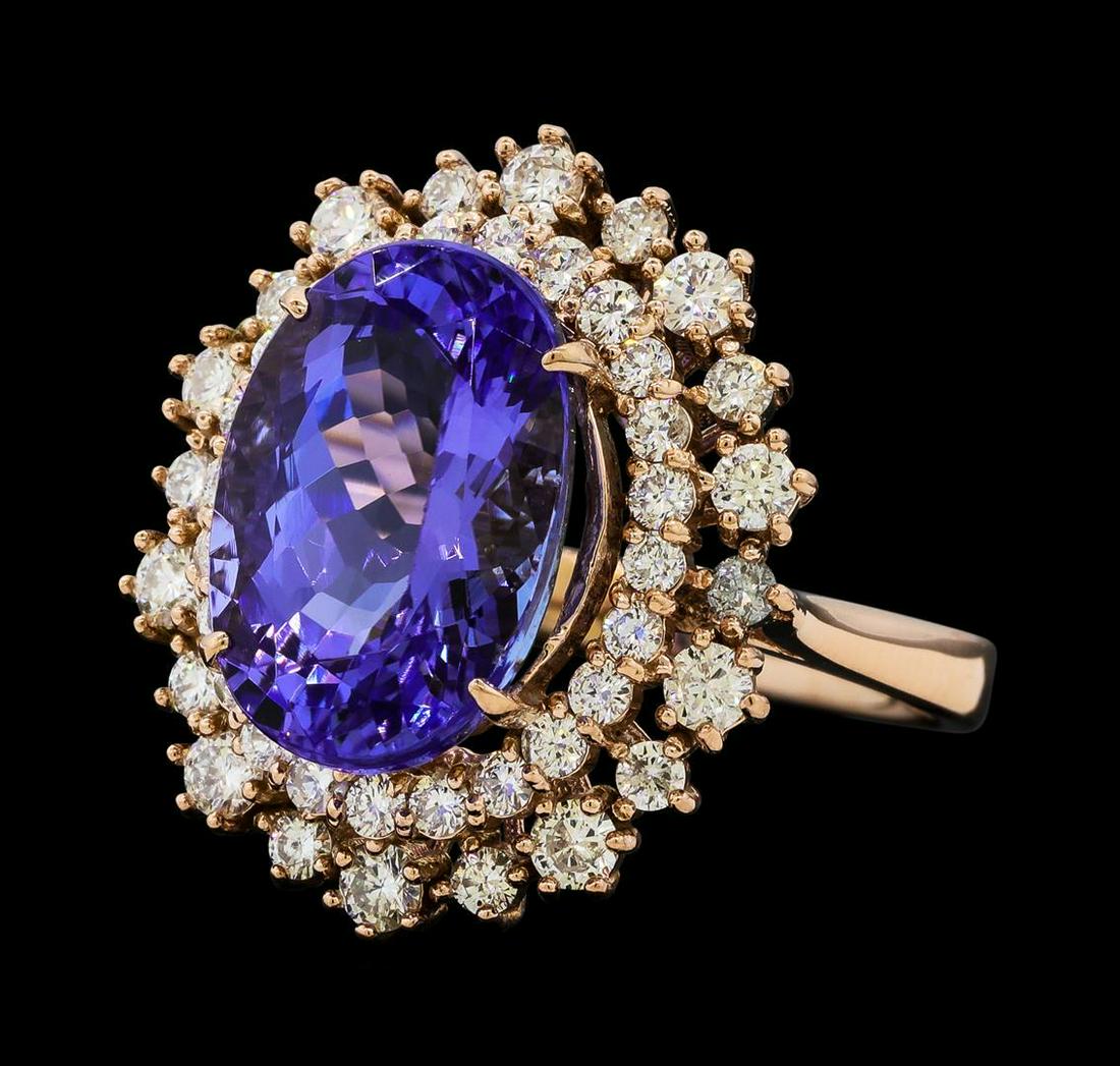7.22 ctw Tanzanite and Diamond Ring - 14KT Rose Gold: One electronically tested 14KT rose gold lady's cast fashion ring with a staggered basket halo with a bright polish finish. The featured lady's ring has a shank measuring 2.85 millimeters wide. Identi