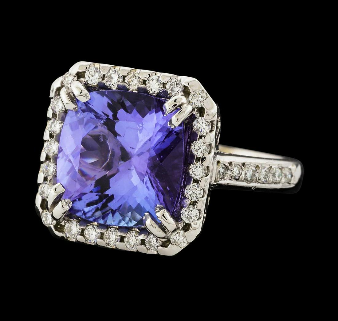 5.71 ctw Tanzanite and Diamond Ring - 14KT White Gold: One electronically tested 14KT white gold lady's cast fashion ring with a square basket halo with a bright polish finish. The featured lady's ring has a shank measuring 2.72 millimeters wide. Identifi