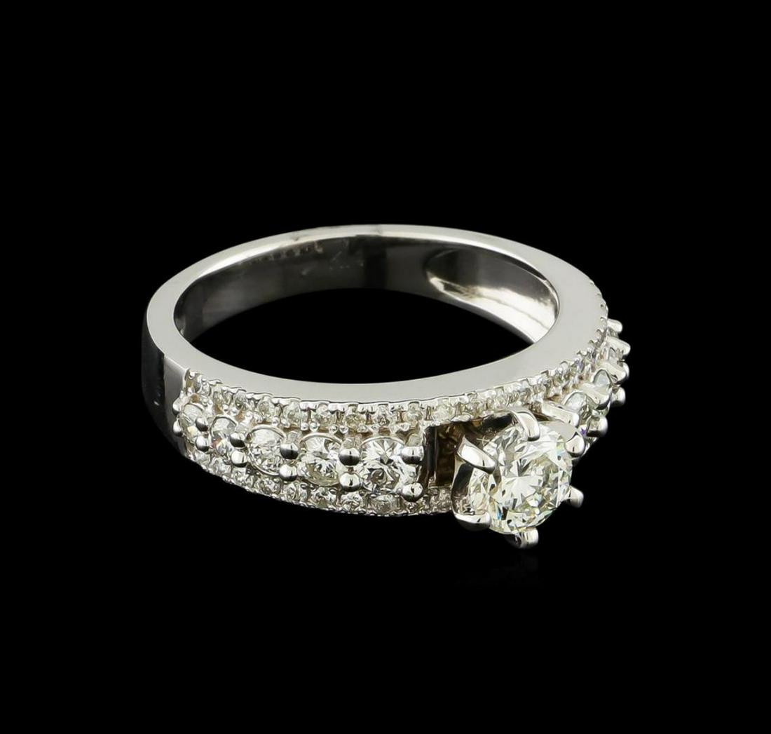 1.25 ctw Diamond Ring - 14KT White Gold: One electronically tested 14KT white gold lady's cast wedding ring with a bright polish finish. The featured lady's ring has a shank measuring 3.03 millimeters wide. Identified with markings of "K14".