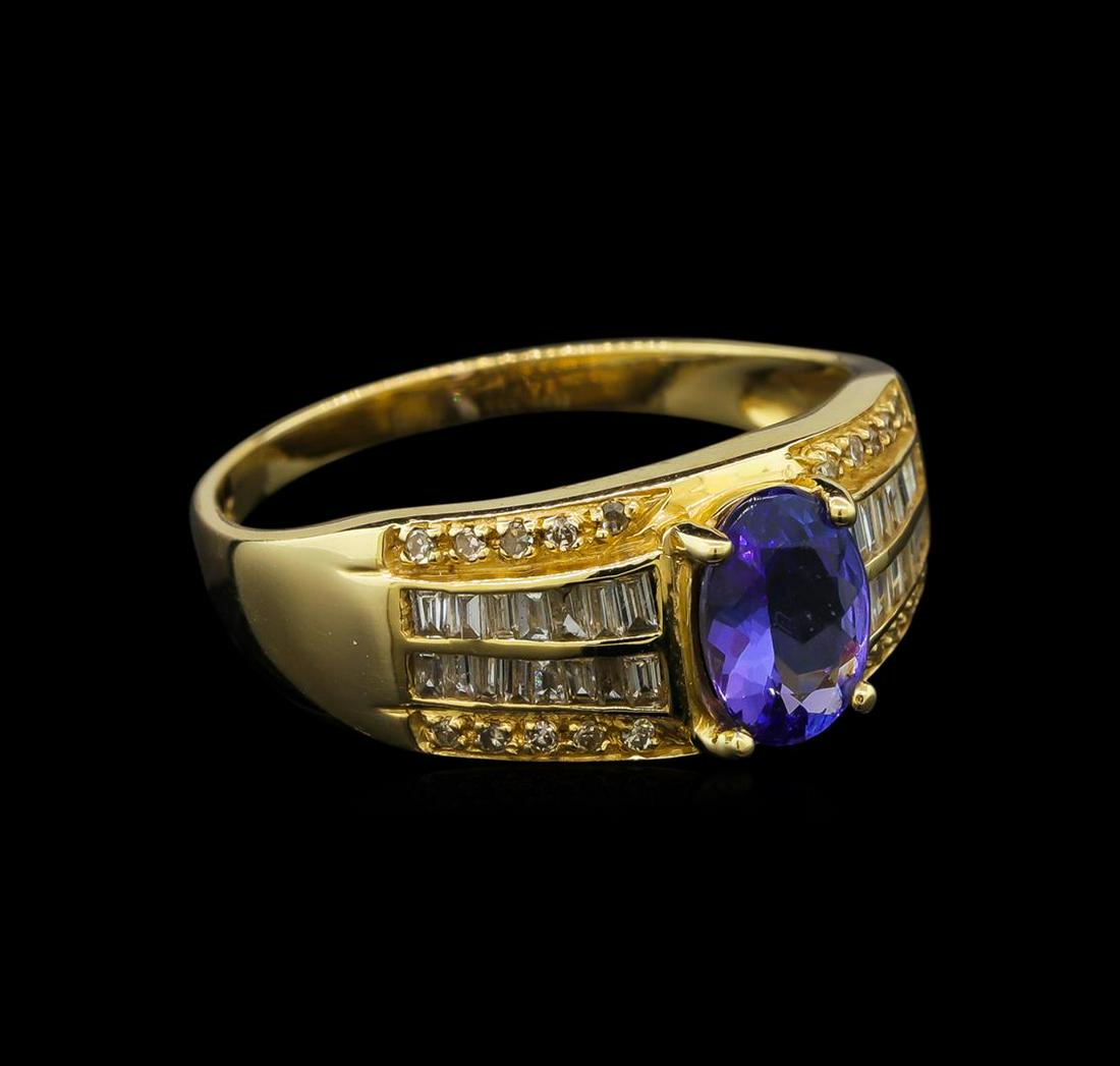 14KT Yellow Gold 1.04 ctw Tanzanite and Diamond Ring: One electronically tested 14KT yellow gold ladies cast tanzanite and diamond ring with a bright polish finish. Identified with markings of "14K". Condition is new. Containing: One prong set oval modif