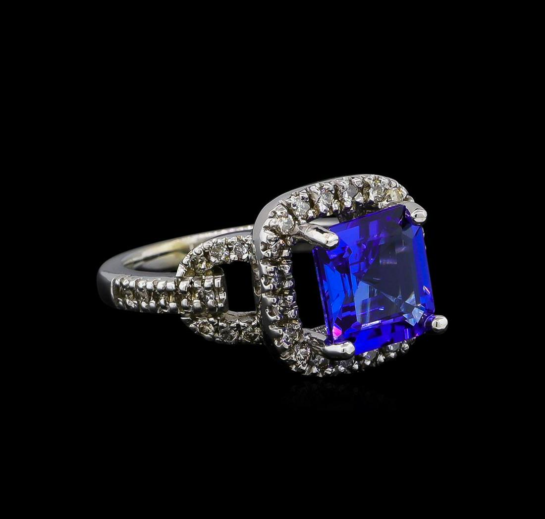 14KT White Gold 3.91 ctw Tanzanite and Diamond Ring: One electronically tested 14KT white gold Ladies combination cast & assembled ring with a bright polish finish. Condition is new. Identified with markings of "14K". Containing: One prong set emerald s
