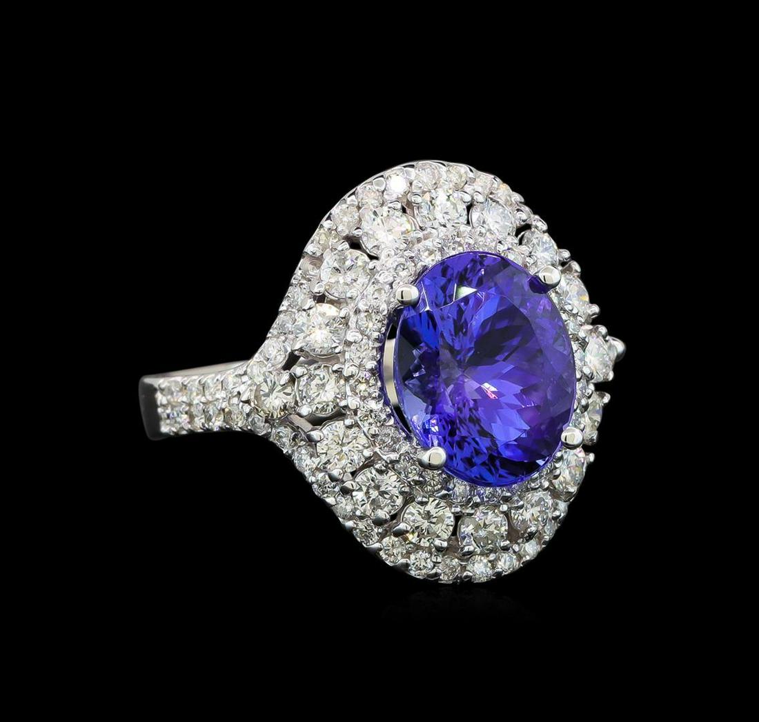 14KT White Gold 3.40 ctw Tanzanite and Diamond Ring: One electronically tested 14KT white gold ladies cast tanzanite and diamond ring with a bright polish finish. Identified with markings of "14K". Condition is new. Containing: One prong set oval modifi