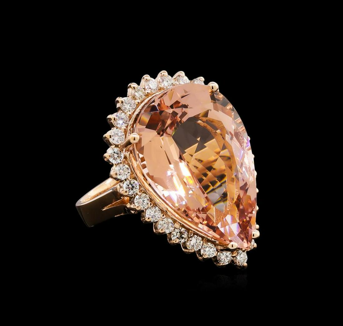 20.71 ctw Morganite and Diamond Ring - 14KT Rose Gold: One electronically tested 14KT rose gold lady's cast fashion ring with a basket halo with a bright polish finish. The featured lady's ring has a shank measuring 3.76 millimeters wide. Identified with 