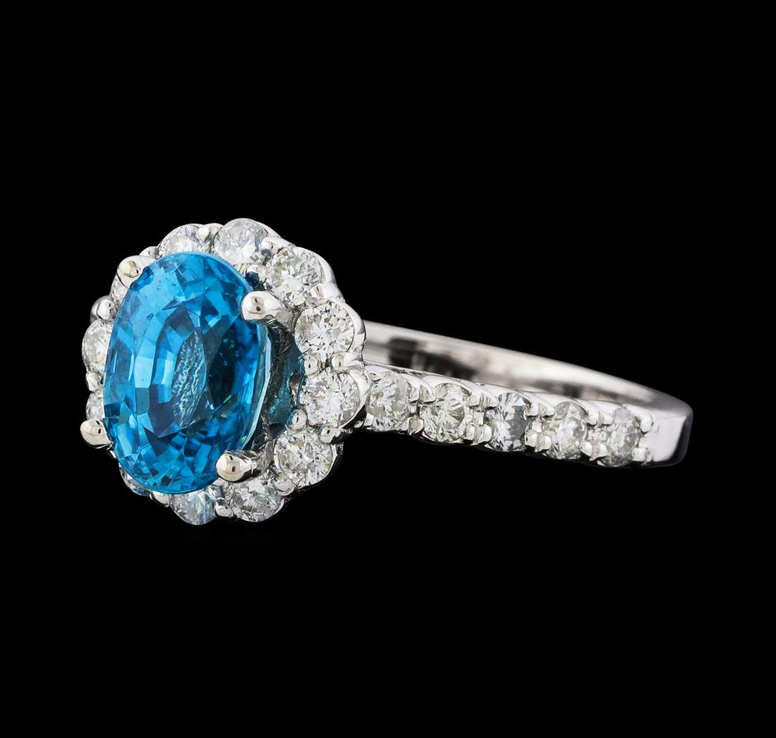 2.34 ctw Blue Zircon and Diamond Ring - 14KT White Gold: One Blue Zircon and Diamond Ring featuring: 14KT White Gold with a total weight of 3.70 grams, Blue Zircon with a total weight of 2.34ct, and side diamonds with a weight of 0.74ctw.