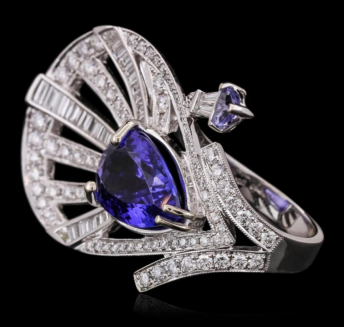 18KT White Gold 6.20 ctw Tanzanite and Diamond Ring: One electronically tested 18KT white gold ladies combination cast & assembled prong set ring with a bright polish finish. Identified with markings of "750". Condition is new. Containing: One prong set