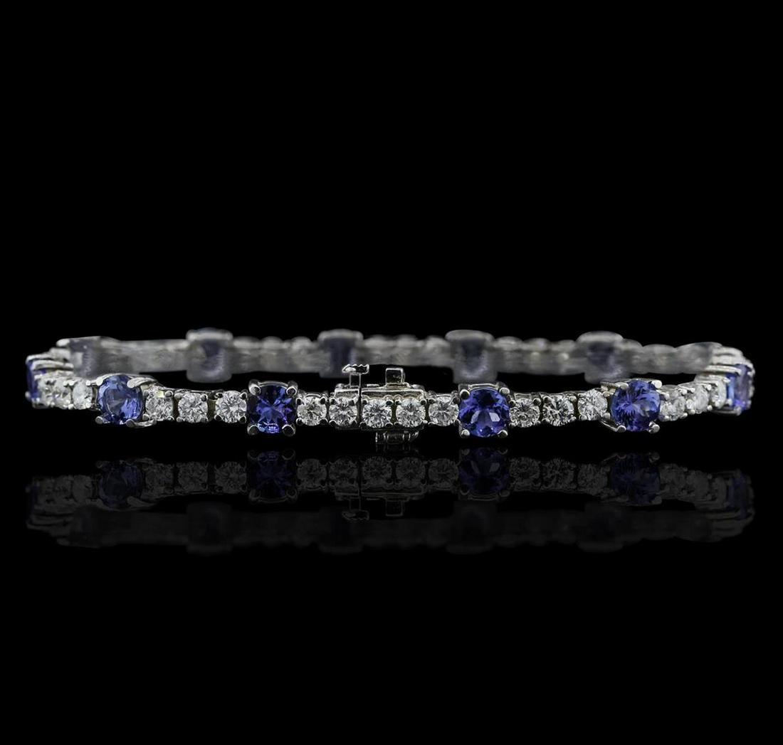 14KT White Gold 6.48 ctw Tanzanite and Diamond Tennis: One electronically tested 14KT white gold ladies combination cast & assembled tennis bracelet with a hidden box clasp with a bright polish finish. Condition is new. Measurements: 7" in length. Identif