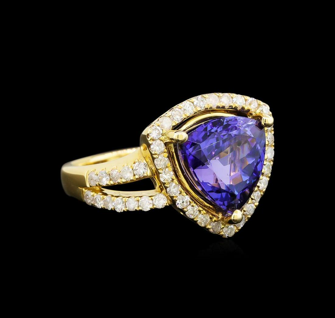 14KT Yellow Gold 5.03 ctw Tanzanite and Diamond Ring: One electronically tested 14KT yellow gold ladies cast tanzanite and diamond ring with a bright polish finish. Trademark is Orianne. Identified with markings of "14K". Condition is new. Containing: On