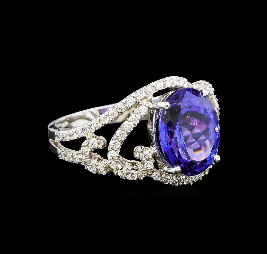 14KT White Gold 4.55 ctw Tanzanite and Diamond Ring: One electronically tested 14KT white gold ladies cast tanzanite and diamond ring with a bright polish finish. Identified with markings of "14K". Condition is new. Containing: One prong set oval modifi