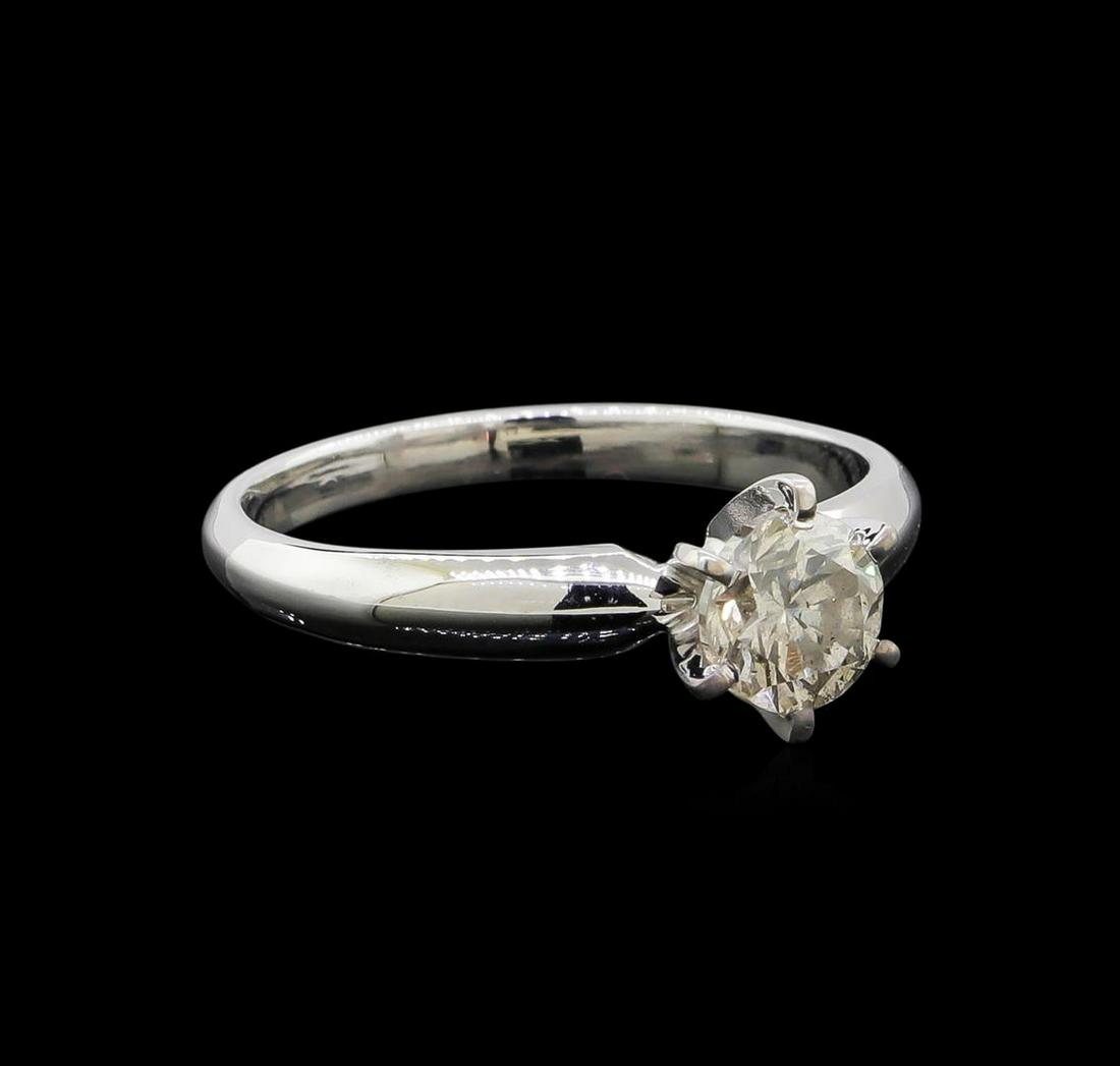14KT White Gold 0.85 ctw Round Cut Diamond Solitaire: One electronically tested 14KT white gold ladies cast diamond solitaire ring with a half round shank with a bright polish finish. Identified with markings of "14K". Condition is new. Containing: One p