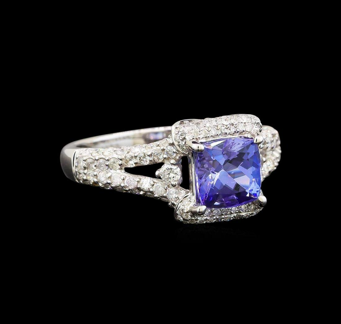 14KT White Gold 1.44 ctw Tanzanite and Diamond Ring: One electronically tested 14KT white gold ladies cast tanzanite and diamond ring with a flat shank with a bright polish finish. Trademark is Orianne. Identified with markings of "14K". Condition is ne