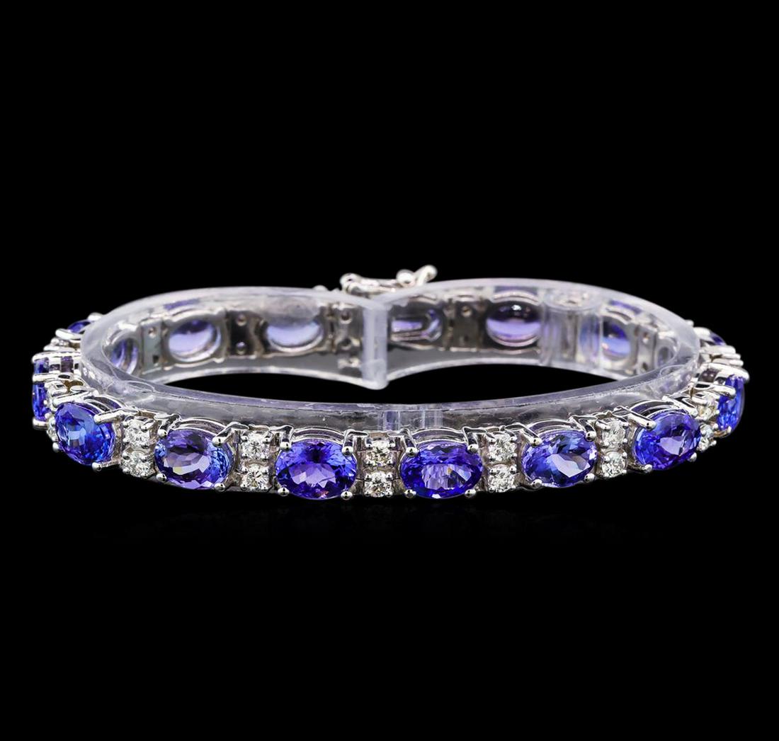 14KT White Gold 17.85 ctw Tanzanite and Diamond: One electronically tested 14KT white gold ladies cast tanzanite and diamond bracelet with a hidden box clasp with safety closer with a bright polish finish. Measurements: 7 " in length Identified with