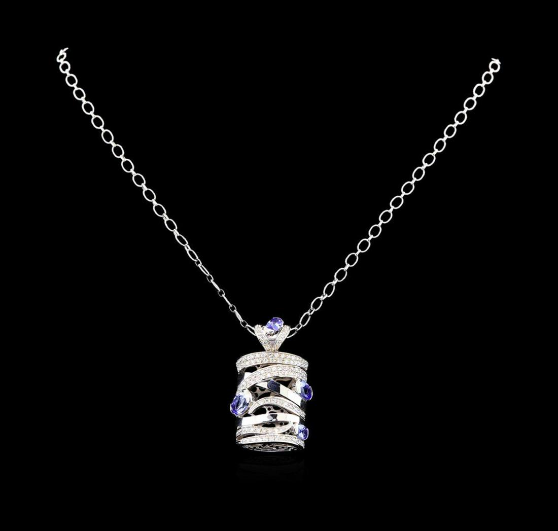 14KT White Gold 3.60 ctw Tanzanite and Diamond Pendant: One electronically tested 14KT white gold ladies cast tanzanite and diamond pendant & chain 18.0" long, with a lobster claw clasp with a bright polish finish. Identified with markings of "585". Condit