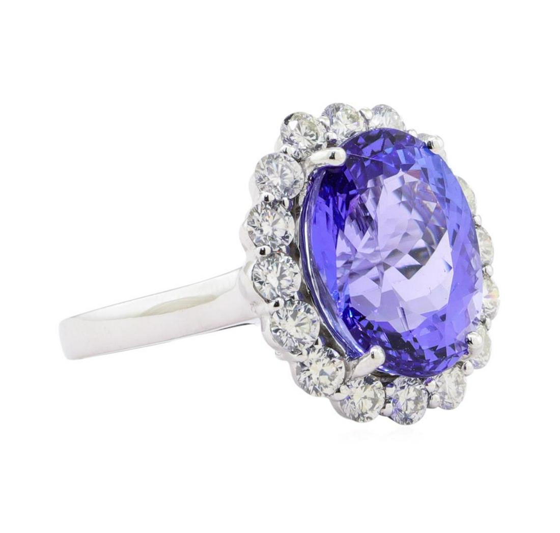 9.25 ctw Tanzanite and Diamond Ring - Platinum: One electronically tested platinum ladies cast tanzanite & diamond ring. The featured tanzanite is set within a diamond floret, supported by a ribbed under gallery, completed by a two millimeter wide