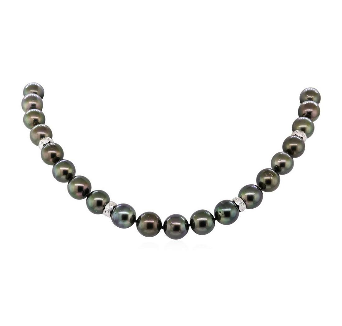 0.40 ctw Diamond and Tahitian Pearl Necklace: One graduated single strand pearl necklace 18.0' princess length, knotted with a tongue clasp containing 35 Tahitian pearls, 13.3mm to 11.0mm in size. The pearls are black in color, green overtone wit