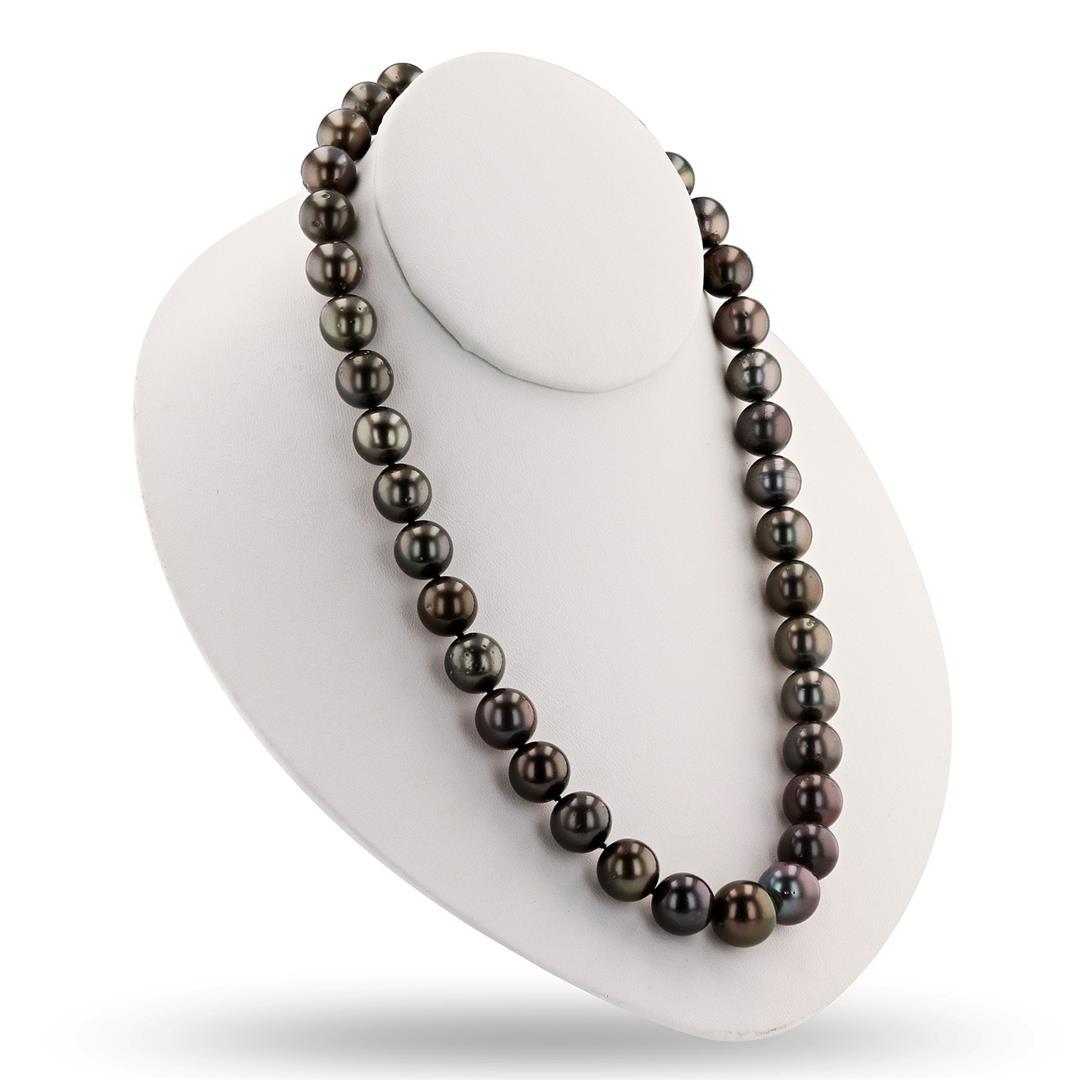 11-13mm Tahitian Pearl 14K White Gold Necklace: Tahitian Parl Necklace One graduated, single strand Cultured Tahitian Pearl necklace. The strand has each pearl individually hand knotted and measures 18.5 inches in length. The necklace is finished w