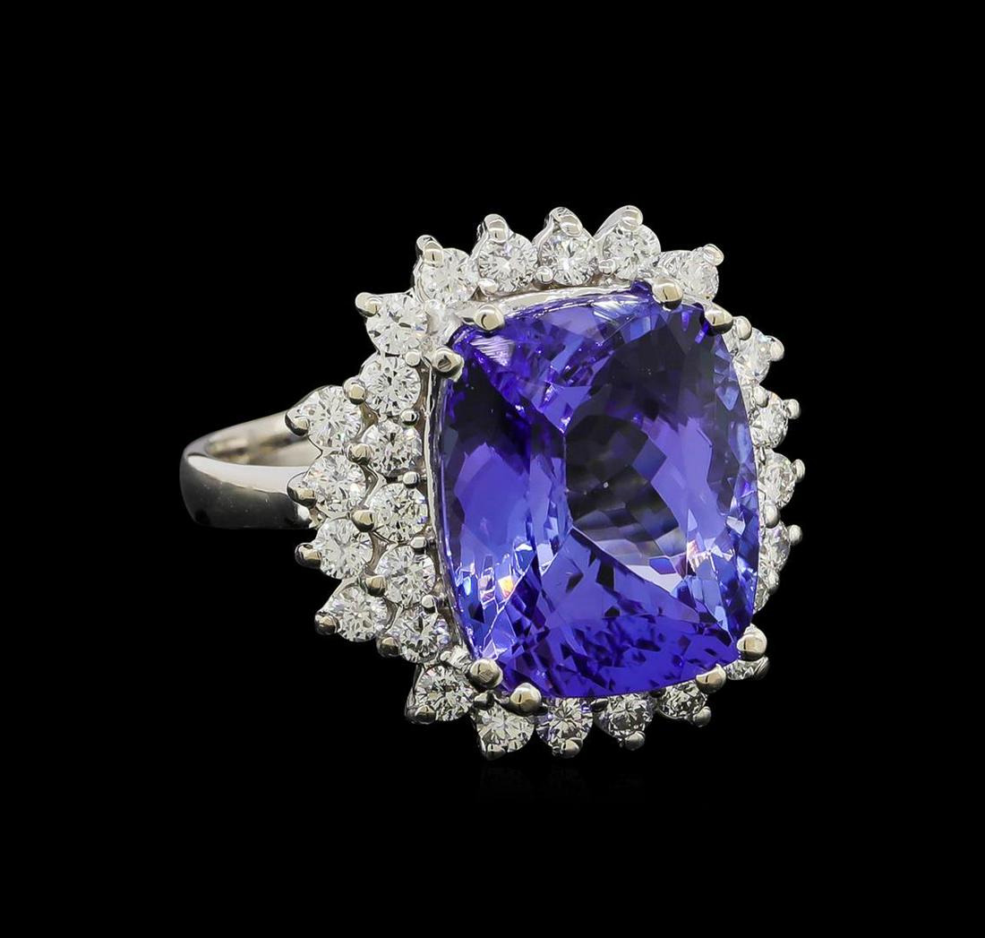 11.23 ctw Tanzanite and Diamond Ring - 14KT White Gold: One electronically tested 14KT white gold lady's cast fashion ring with a double basket halo with a bright polish finish. The featured lady's ring has a shank measuring 2.66 millimeters wide. Identifi