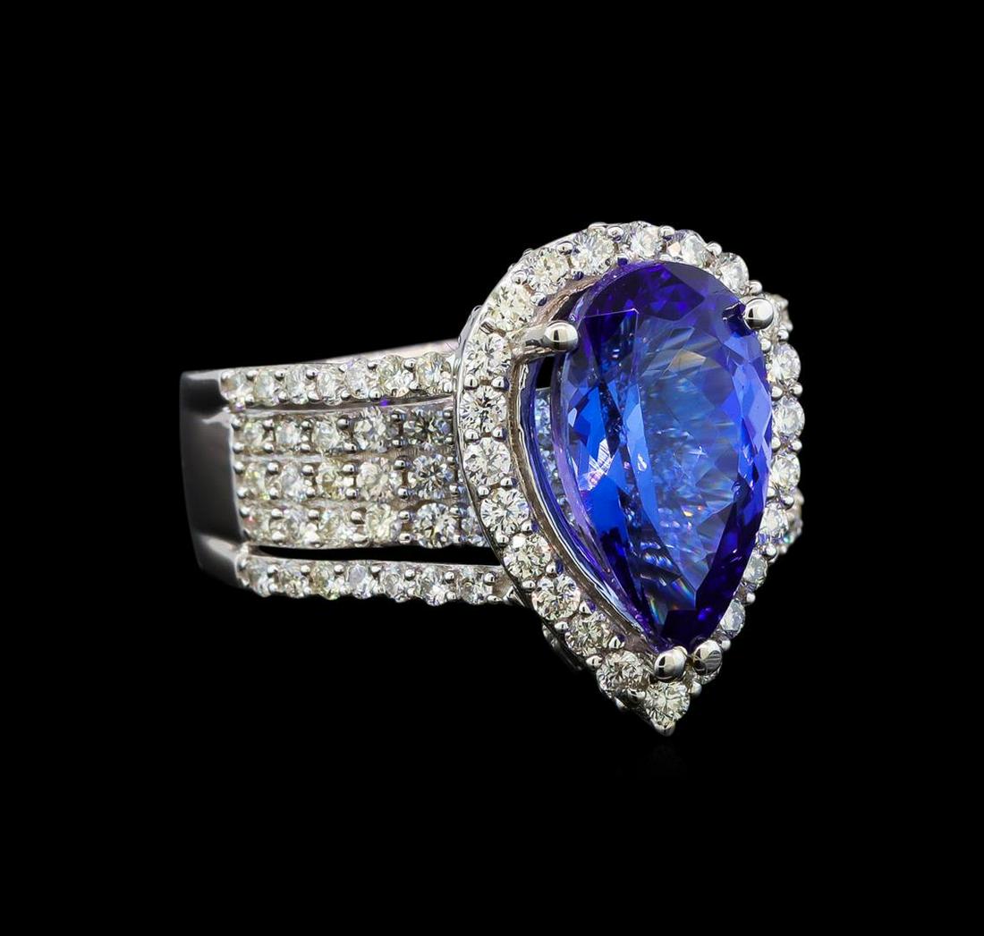 18KT White Gold 3.66 ctw Tanzanite and Diamond Ring: One electronically tested 18KT white gold ladies cast tanzanite and diamond ring with a bright polish finish. Identified with markings of "18K". Condition is new. Containing: One prong set pear modifi