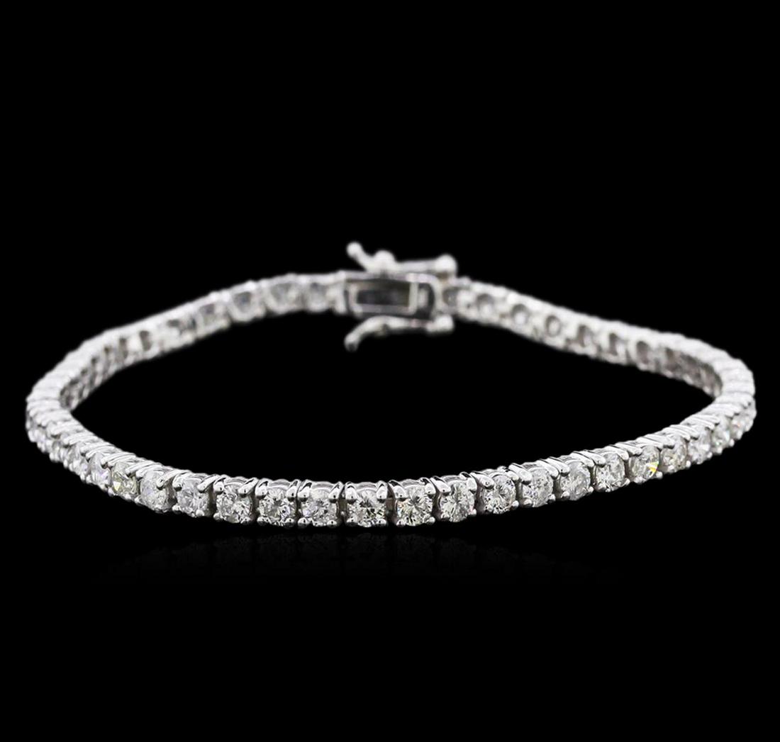 14KT White Gold 4.49 ctw Diamond Tennis Bracelet: One electronically tested 14KT white gold ladies cast diamond tennis bracelet with a hidden box clasp with safety closer with a bright polish finish. Measurements: 7" in length Identified with marking