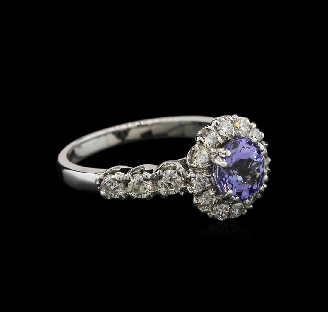 1.33 ctw Tanzanite and Diamond Ring - 14KT White Gold: One ring featuring: 14KT white gold weighing 4.19 grams containing one tanzanite center stone with a total weight of 1.33ct and 18 diamonds with a total weight of 0.83ct.