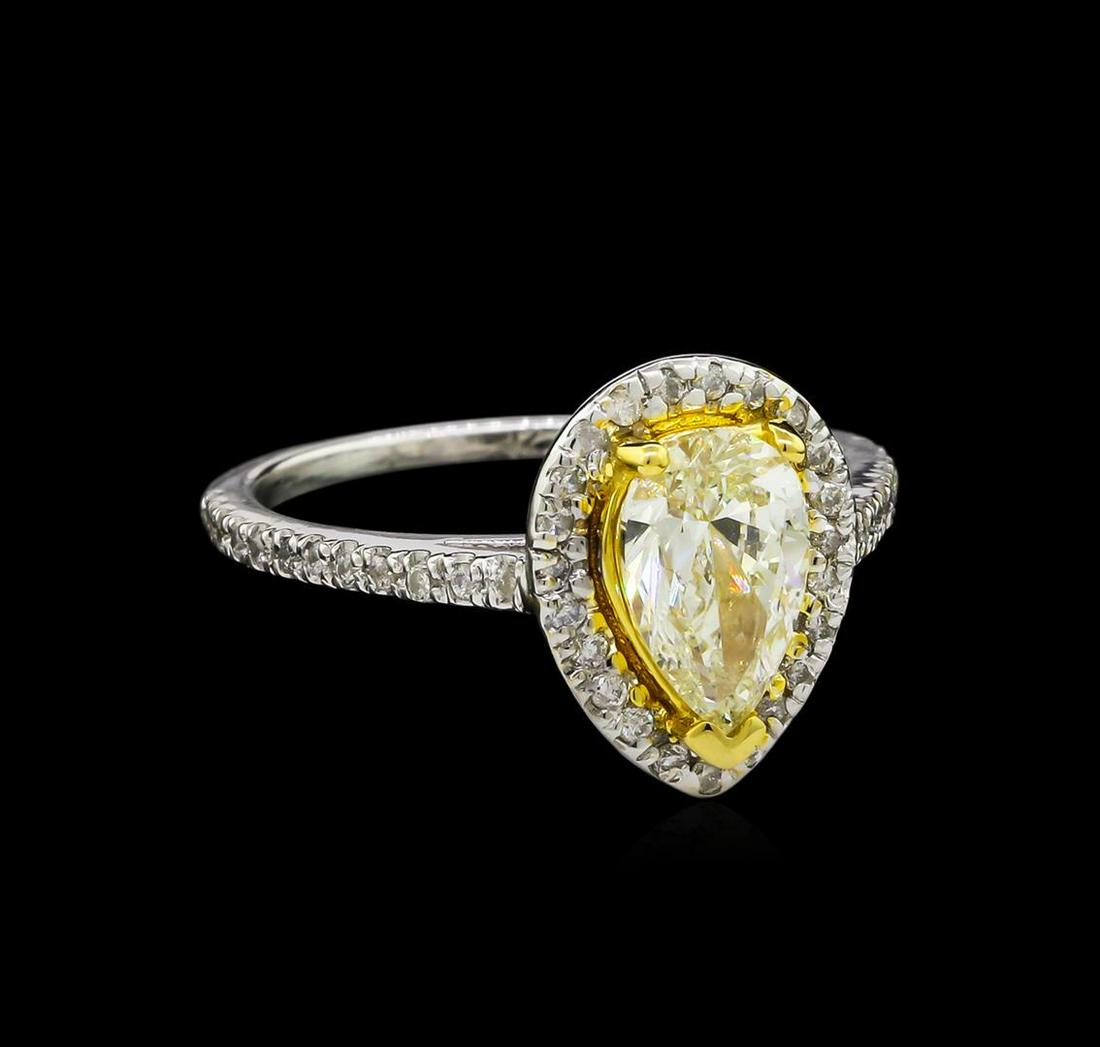 1.25 ctw Fancy Light Yellow Diamond Ring - 14KT: One electronically tested 14KT white and yellow gold lady's combination cast & assembled wedding ring with a cathedral shank with a halo with a bright polish finish. The featured lady's ring has a sha