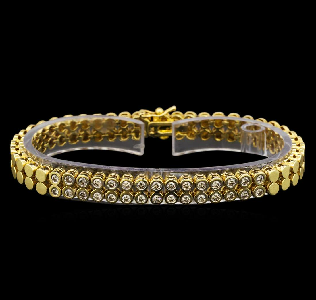 14KT Yellow Gold 1.04 ctw Diamond Bracelet: One electronically tested 14KT yellow gold ladies cast & assembled diamond bracelet with a bright polish finish. The seven inch wearable length bracelet features a double diamond set ribbon transition