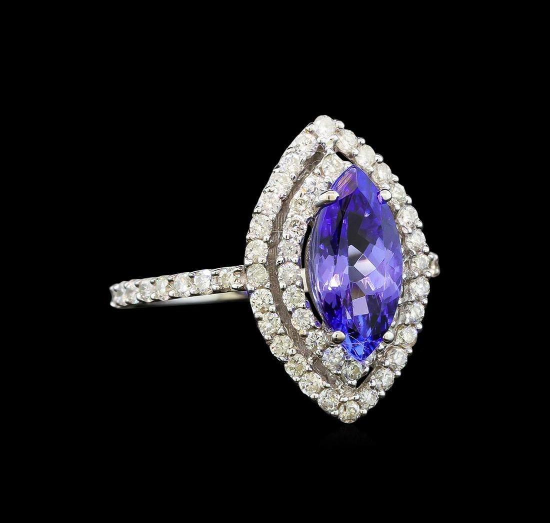 14KT White Gold 1.64 ctw Tanzanite and Diamond Ring: One electronically tested 14KT white gold ladies cast tanzanite and diamond ring with a bright polish finish. Identified with markings of "14K". Condition is new. Containing: One prong set marquise mo