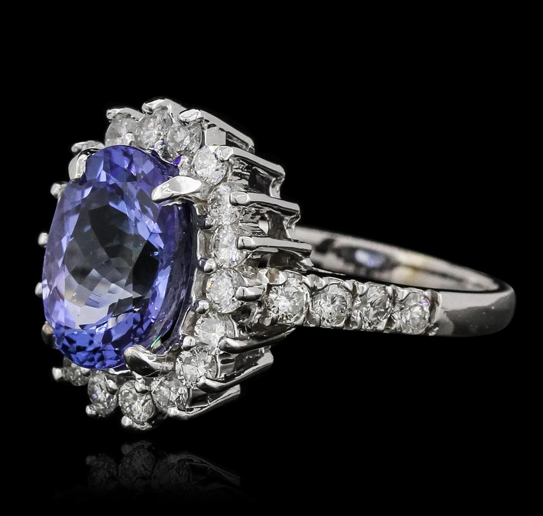 14KT White Gold 3.63 ctw Tanzanite and Diamond Ring: One electronically tested 14KT white gold ladies combination cast & assembled ring with a bright polish finish. Identified with markings of "14K". Condition is new. Containing: One prong set oval modi