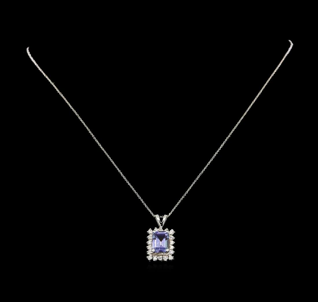 14KT White Gold 1.89 ctw Tanzanite and Diamond Pendant: One electronically tested 14KT white gold ladies combination cast & assembled tanzanite and diamond pendant & chain 16.0" long, cable link with a spring ring clasp with a bright polish finish. Identif