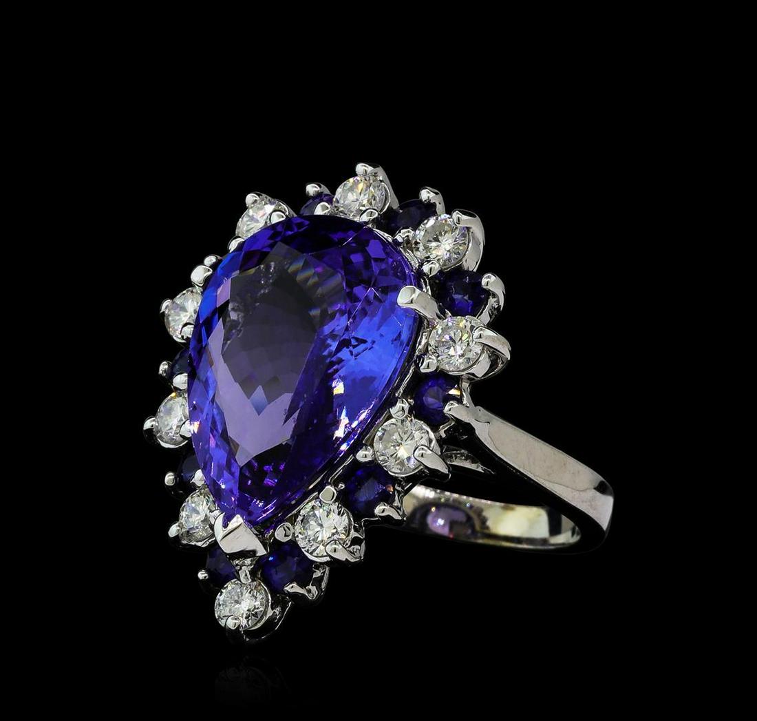 10.02 ctw Tanzanite, Blue Sapphire, and Diamond Ring -: One electronically tested 14KT white gold ladies cast tanzanite, sapphire and diamond ring with a bright polish finish. The featured tanzanite is set within a sapphire and diamond floret supported by 