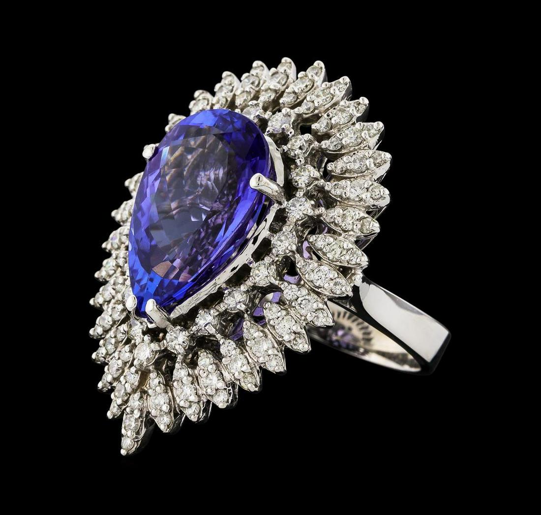 GIA Cert 8.48 ctw Tanzanite and Diamond Ring - 14KT: One electronically tested 14KT white gold lady's cast fashion ring with a triple basket halo with a bright polish finish. The featured lady's ring has a shank measuring 3.26 millimeters wide. Identifi