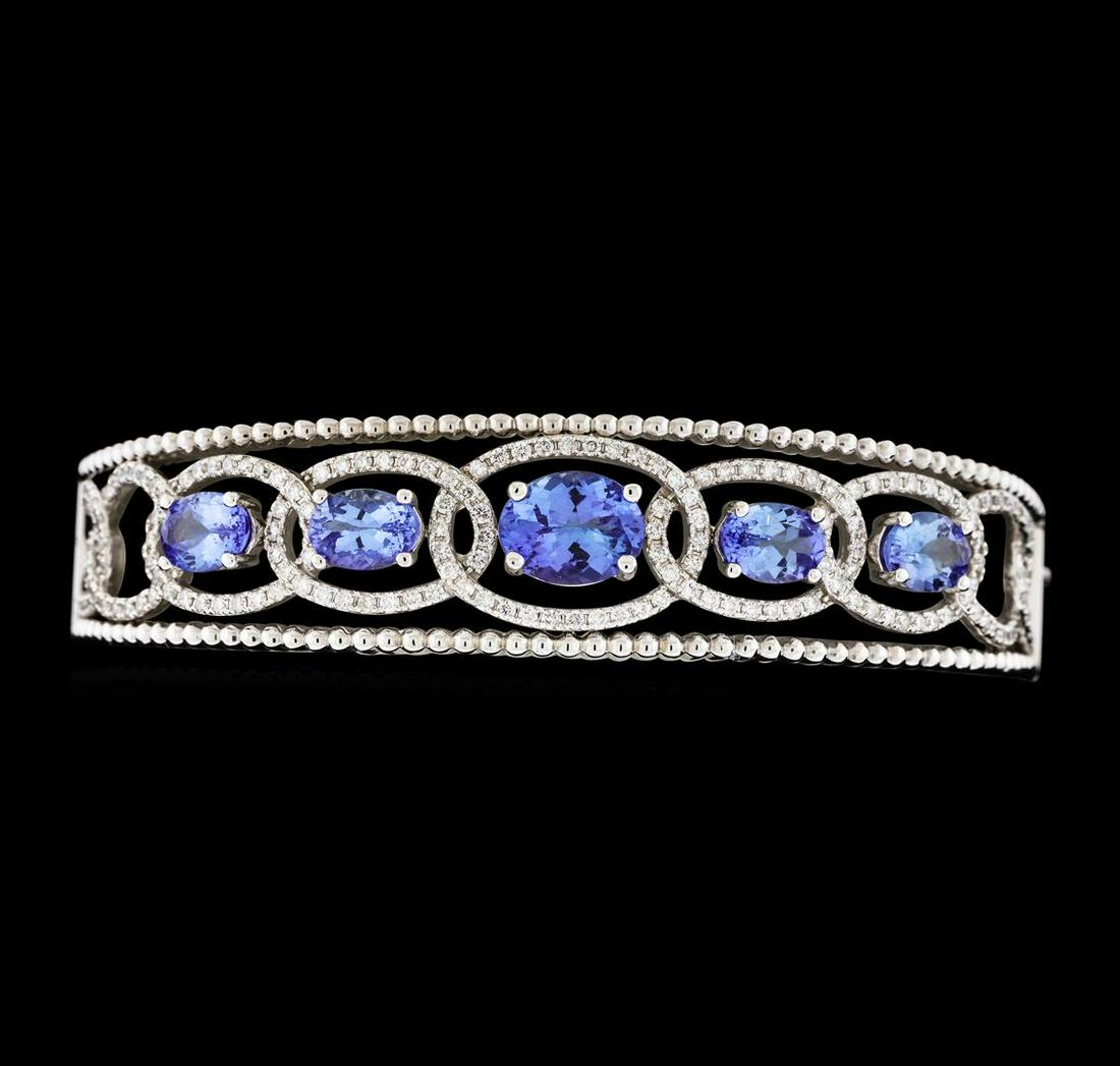 5.03 ctw Tanzanite and Diamond Bracelet - 14KT White: One electronically tested 14KT white gold lady's combination cast & assembled fashion bangle bracelet with a tongue clasp with foldover safety with a bright polish finish. The featured lady's bracelet
