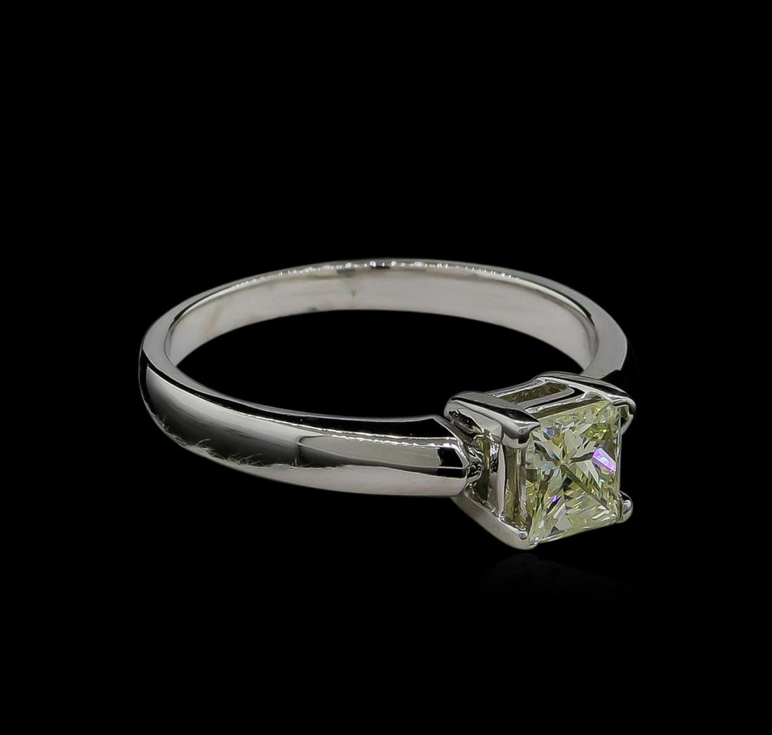 0.70 ctw Light Yellow Diamond Solitaire Ring - 14KT: One electronically tested 14KT white gold ladies cast diamond solitaire ring with a bright finish. Identified with markings of "14K". Condition is new, good workmanship. Containing: One prong set prin