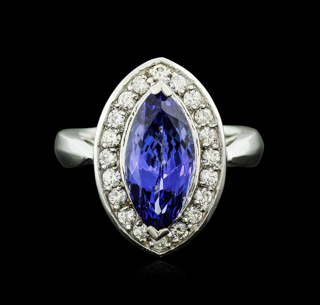 14KT White Gold 4.01 ctw Tanzanite and Diamond Ring: One electronically tested 14KT white gold ladies cast tanzanite and diamond ring with a bright polish finish. Identified with markings of "14K". Condition is new. Containing: One prong set marquise mo