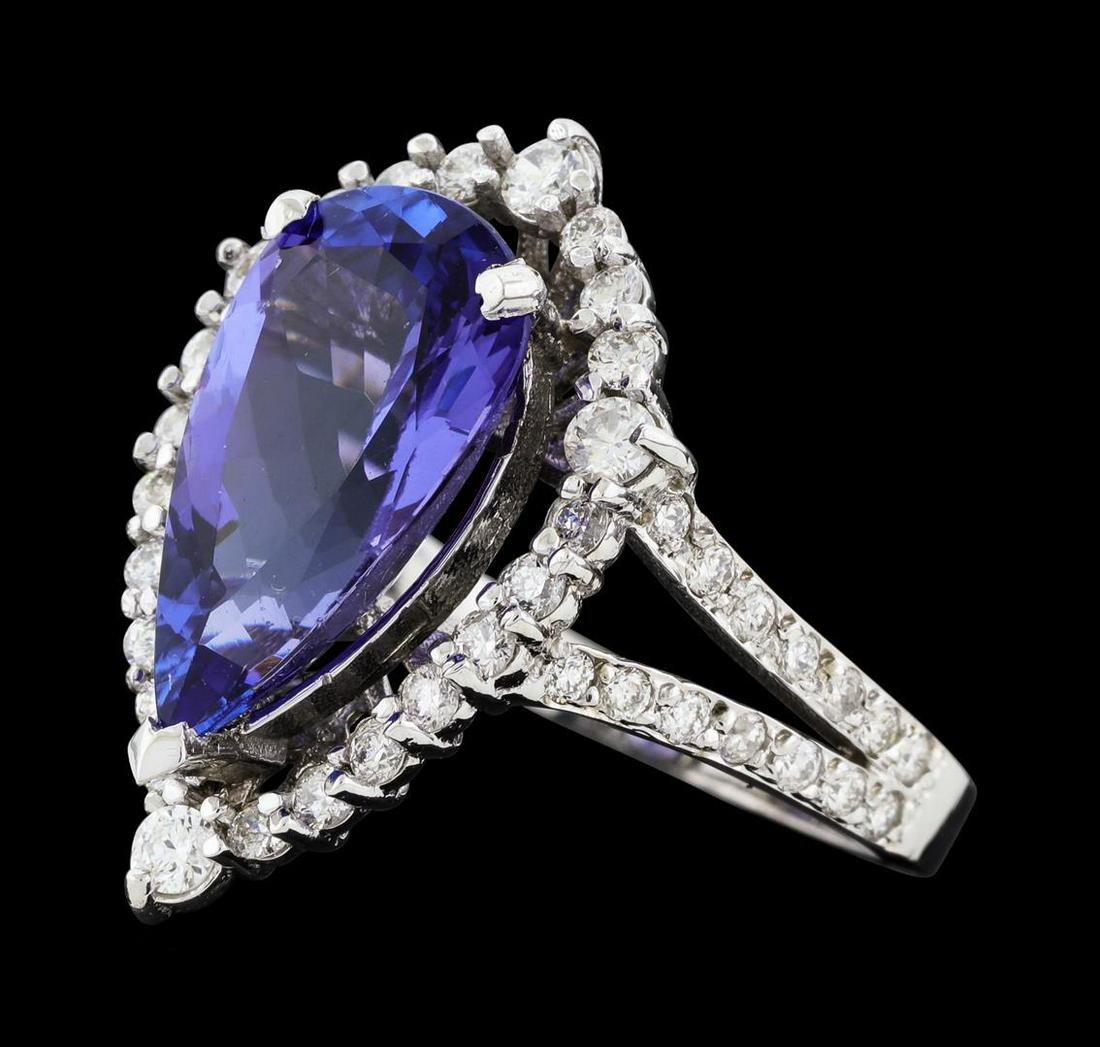 4.16 ctw Tanzanite and Diamond Ring - 14KT White Gold: One electronically tested 14KT white gold lady's cast fashion ring with a split shank basket halo with a bright polish finish. The featured lady's ring has a shank measuring 1.77 millimeters wide. Ide