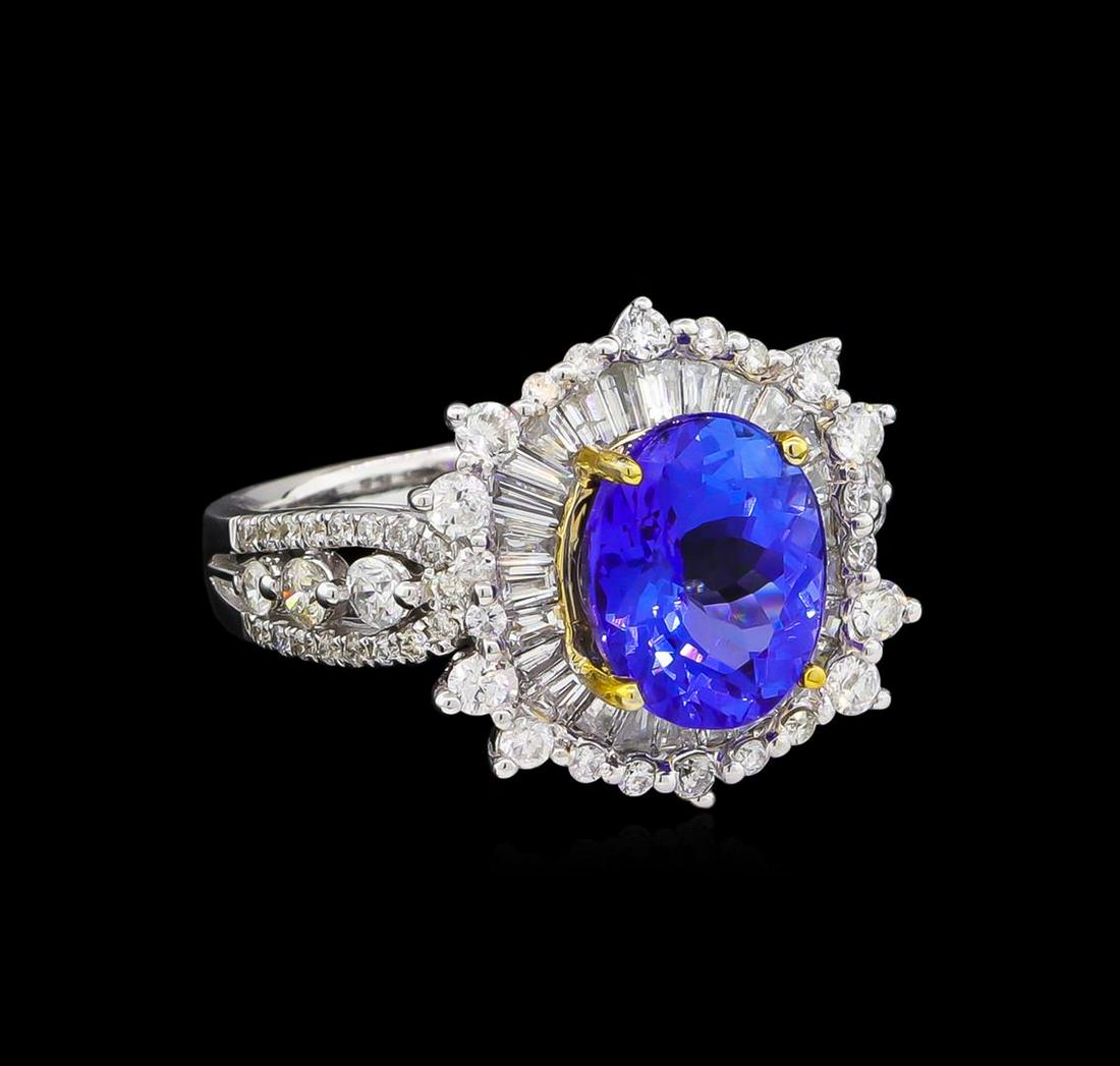 14KT Two-Tone Gold 3.15 ctw Tanzanite and Diamond Ring: One electronically tested 14KT white and yellow gold Ladies combination cast & assembled ring with a bright polish finish. Condition is new. Identified with markings of "14K". Containing: One prong se
