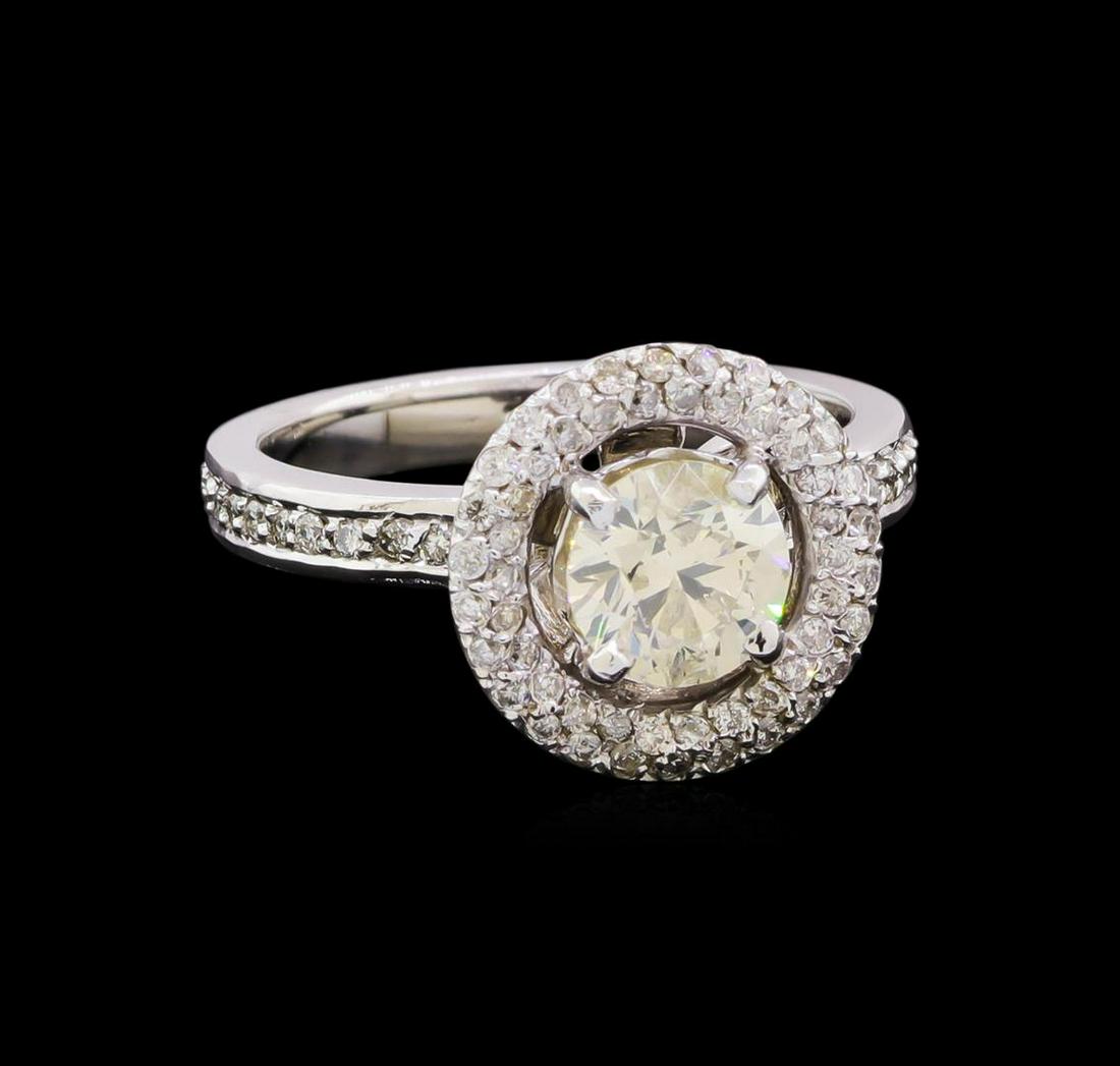 1.55 ctw Diamond Halo Ring - 14KT White Gold: One electronically tested 14KT white gold lady's cast wedding ring with a basket halo with a bright polish finish. Featured lady's ring has a shank measuring 2.55 millimeters in width. Identified with