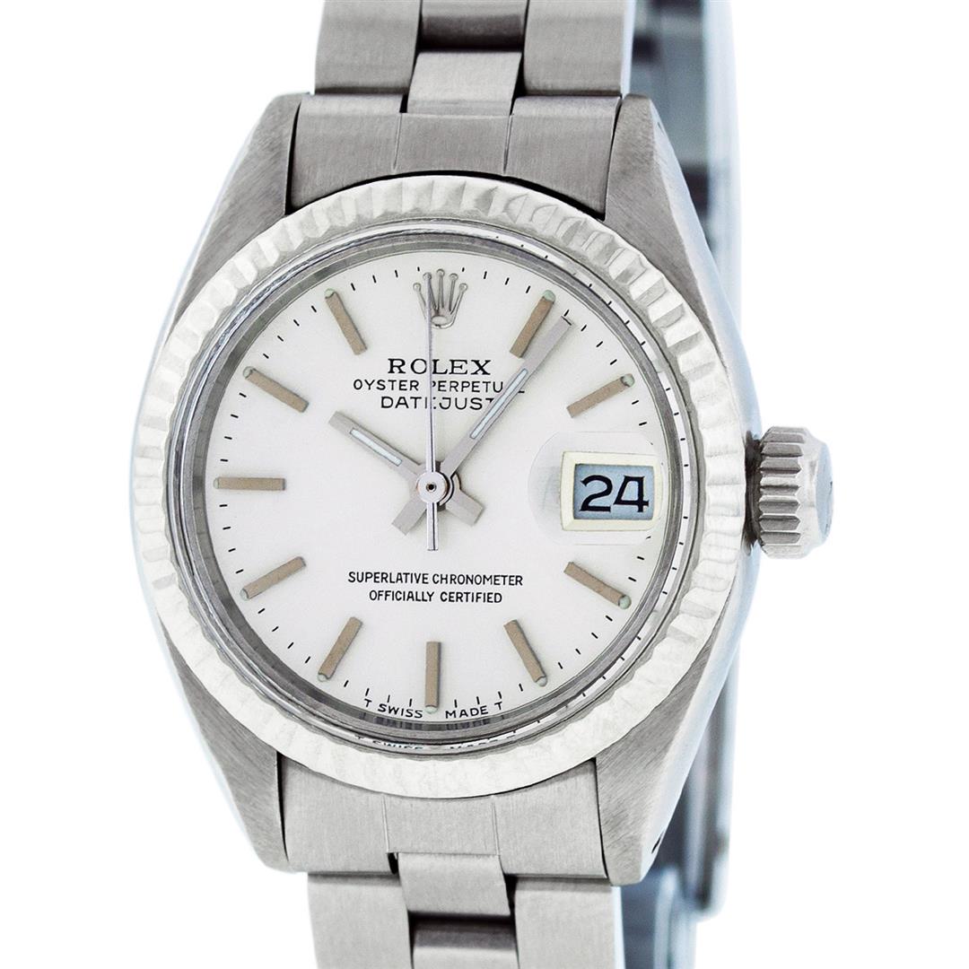 Rolex Ladies Stainless Steel Silver Index Oyster Band: One Ladies Stainless Steel Rolex Datejust Polished Bright with Satin Finish, Serviced & Electronically Tested, Stainless Steel Case: 26mm, Stainless Steel Crown, Bezel: 14K White Gold Fluted Bezel. Cu