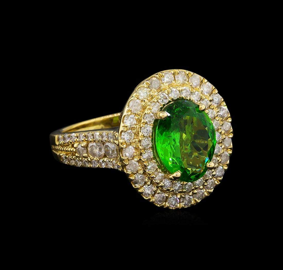 2.70 ctw Tsavorite and Diamond Ring - 14KT Yellow Gold: One electronically tested 14KT yellow gold lady's cast fashion ring with a basket double halo with a bright polish finish. The featured lady's ring has a shank measuring 2.26 millimeters wide. Tradema