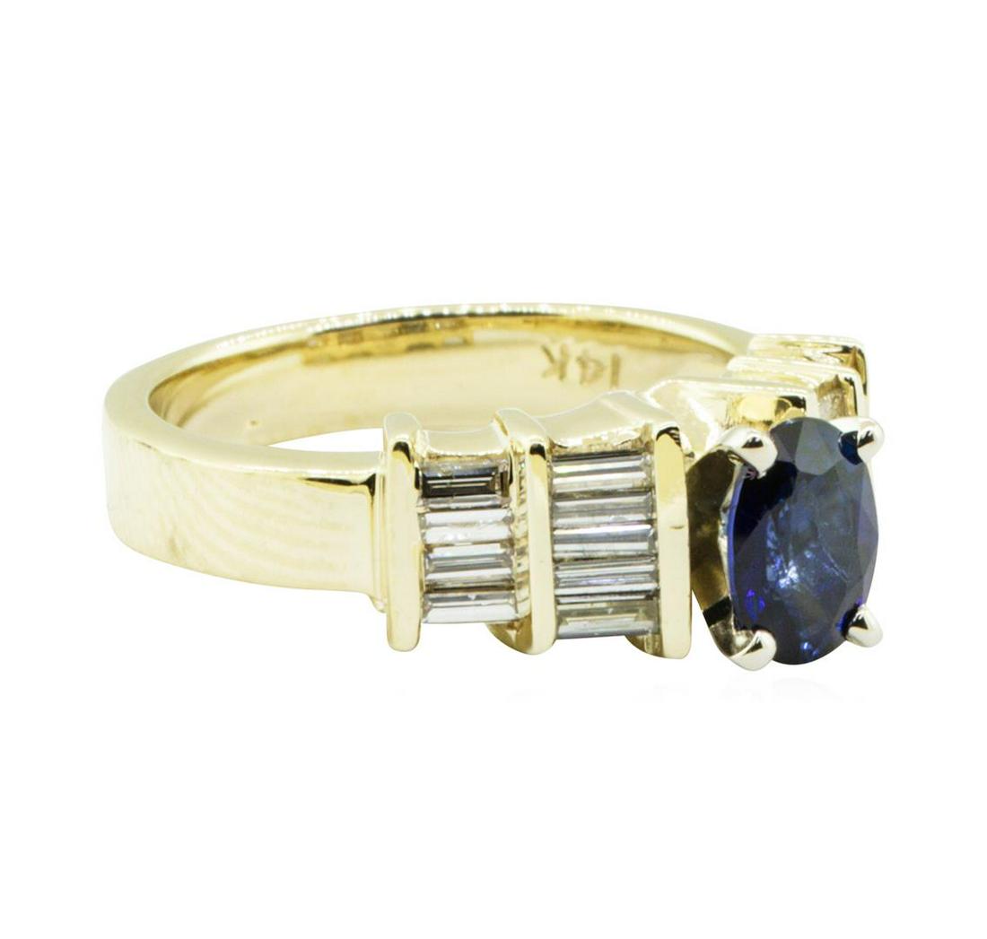 1.36 ctw Oval Brilliant Blue Sapphire And Diamond Ring: One electronically tested 14KT yellow gold lady's combination cast & assembled fashion straight line ring with a step motif with a bright polish finish. The featured lady's ring has a shank measuring