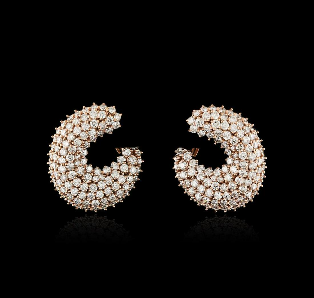 14KT Rose Gold 6.30 ctw Diamond Earrings: One pair electronically tested 14KT rose gold ladies cast diamond earrings with Omega clip backs with a bright polish finish. Identified with markings of "585". Condition is new. Containing: Two hundr