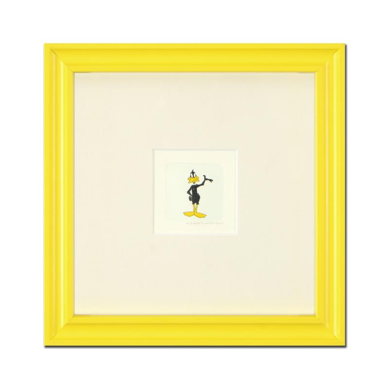 "Daffy Duck" Framed Limited Edition Etching with: "Daffy Duck (Looking to the Side)" is a limited edition etching on paper with hand-tinted coloring from Warner Bros, numbered and dated 1999. This piece comes framed. Measures approx. 9" x 9" (with fr